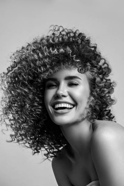 black and white portrait of a beautiful girl with curly hair - hairstyle black and white women fashion imagens e fotografias de stock