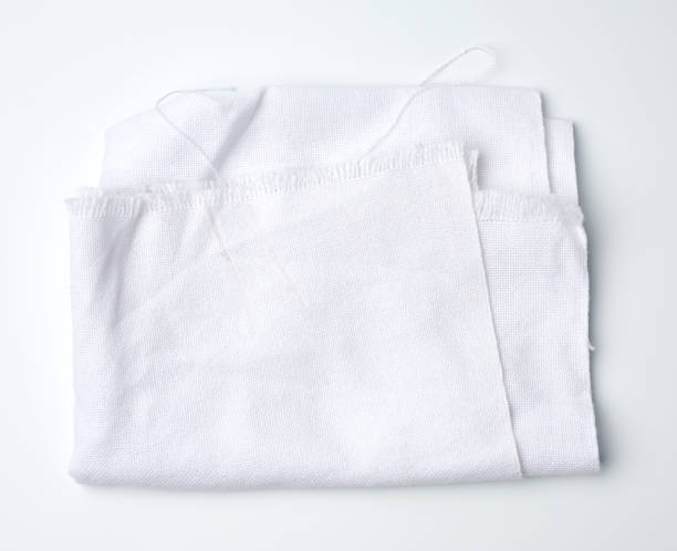 istock folded cotton white cotton fabric on a white background, 1269095409