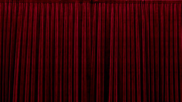 istock 3d render red velvet curtain on a black background 1269097936