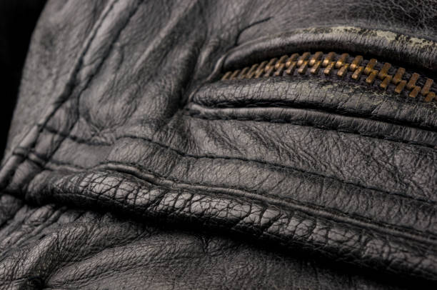 istock Old vintage genuine soft black leather texture background, top layer with pores and scratches, macro, close-up 1269098339