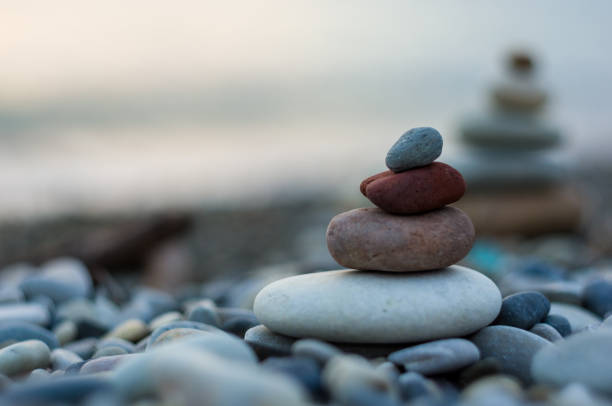 istock stack of zen stones on pebble beach 1269098584