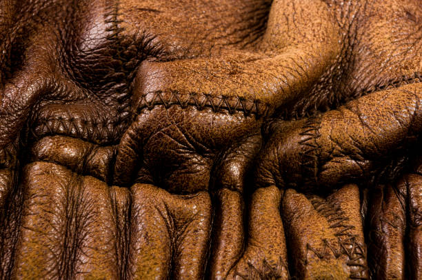 istock Old vintage genuine soft brown leather texture background, top layer with pores and scratches, macro, close-up 1269099062