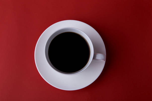 istock Expresso coffee in a white cup on a red background 1269099337