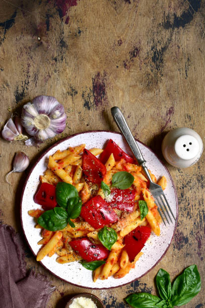 istock Penne pasta with tomato sauce and grilled bell pepper 1269099426