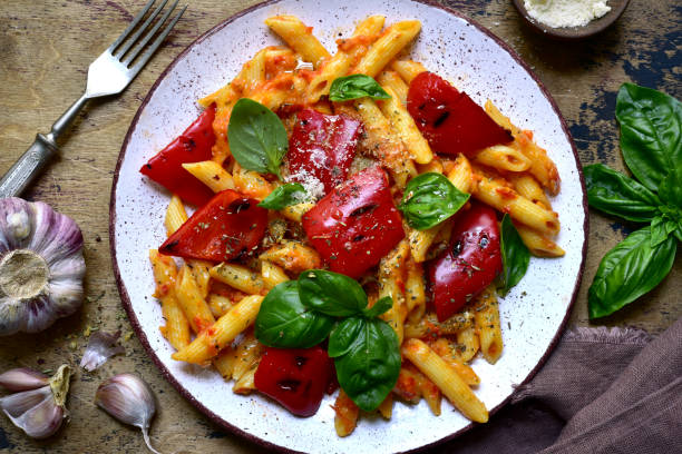 istock Penne pasta with tomato sauce and grilled bell pepper 1269099428