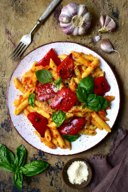 istock Penne pasta with tomato sauce and grilled bell pepper 1269099494