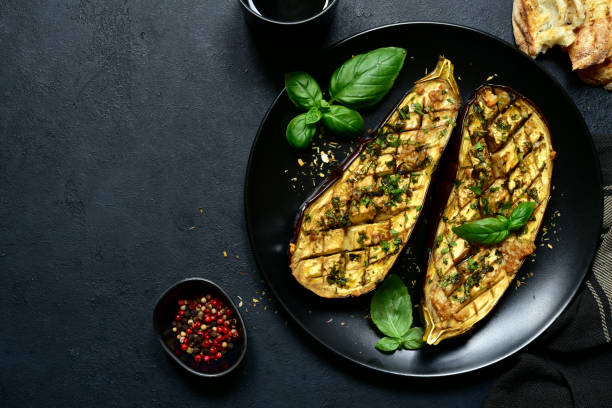 istock Grilled spicy eggplants on a black plate 1269099510