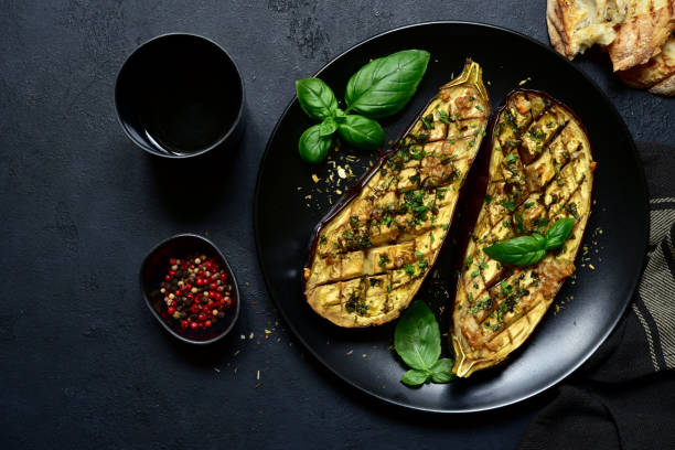 istock Grilled spicy eggplants on a black plate 1269099537