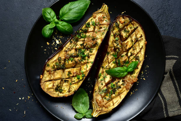 istock Grilled spicy eggplants on a black plate 1269099581
