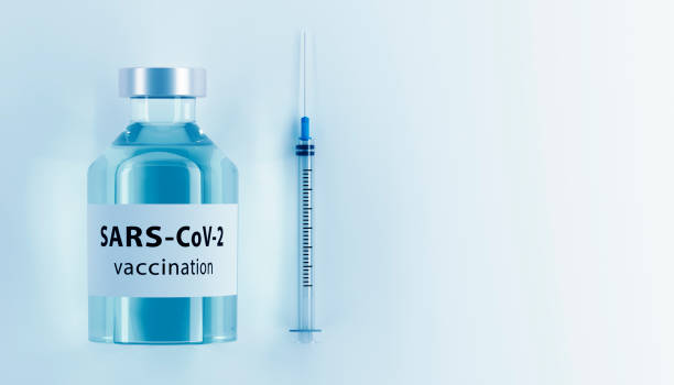istock Corona virus vaccine development with ampoule 1269099757