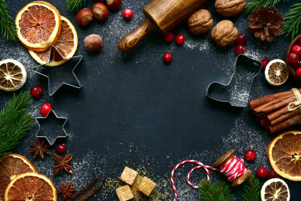 Photo of Christmas baking background with ingredients for making cake or biscuit