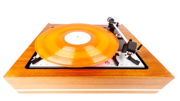 istock Vintage turntable with a red vinyl isolated on white 1269100364