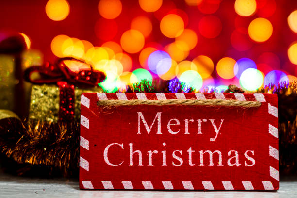 istock Decorations and ornaments in a colorful Christmas composition isolated on background of blurred lights. 1269102088