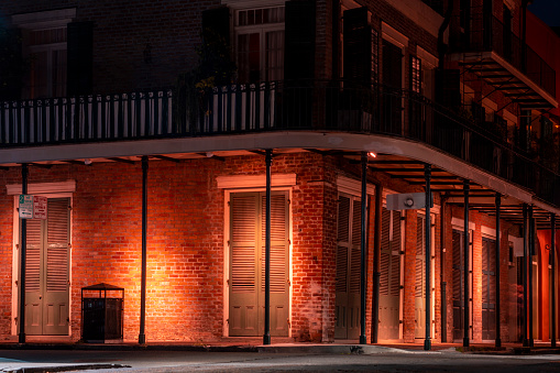 French quarter streetscape at night in New Orleans, Louisiana.