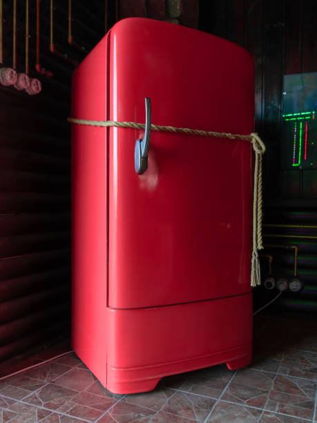 istock red vintage refrigerator tied with rope. 1269103741