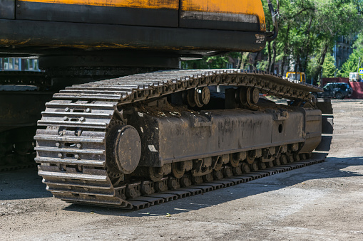 Close-up of a heavy duty tractor track or military vehicle while parked