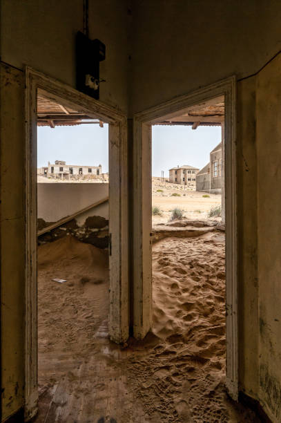 istock Decaying architecture at Kolmanskop, an abandoned diamond mining town 1269115852