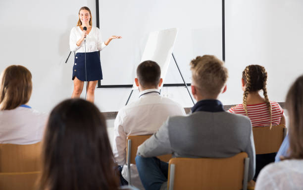 istock Female coach giving presentation for audience 1269117284