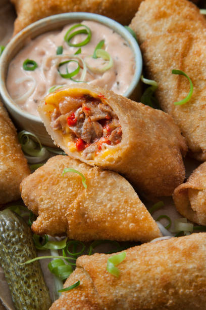 istock Philly Cheese Steak Egg Rolls with Onions and Roasted Red Peppers 1269117724