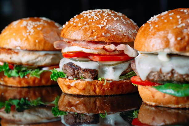 istock Juicy beef Burgers on a black background. 1269122430