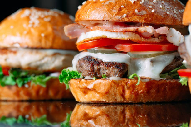 istock Juicy beef Burgers on a black background. 1269122508