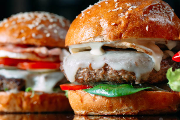 istock Juicy beef Burgers on a black background. 1269122534