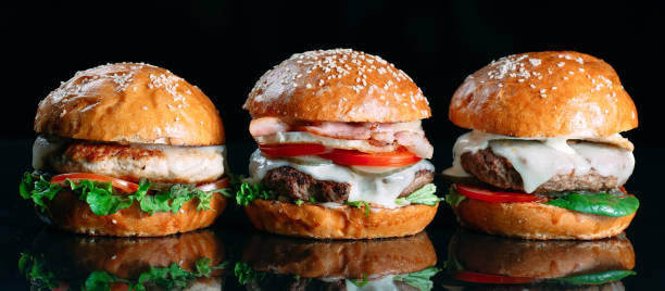 istock Juicy beef Burgers on a black background. 1269122603