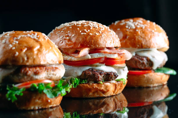 istock Juicy beef Burgers on a black background. 1269122656