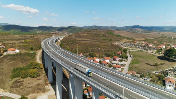 istock Viaduct, traffic, truck. Drone view. Sunny day, blue sky 1269122817