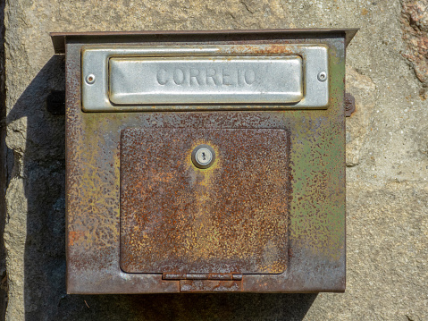 rust-colored brown square letterbox.