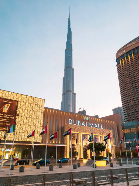 Dubai mall main entrance with Burj Khalifa in rising in the background Dubai, United Arab Emirates - August 25, 2020: Dubai mall main entrance with Burj Khalifa in rising in the background. Largest shopping mall by area and one of the main attractions in Dubai, UAE dubai mall stock pictures, royalty-free photos & images