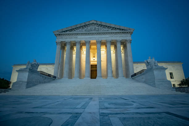Supreme Court of the United States The U.S. Supreme Court building at night supreme court stock pictures, royalty-free photos & images