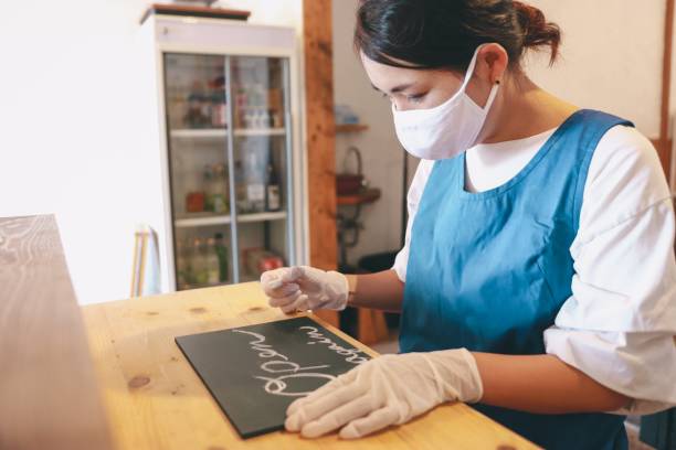 istock Small business reopening signboard OPEN AGAIN 1269126139