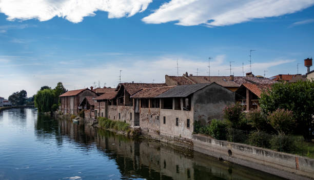 istock Canal with farm 1269126164