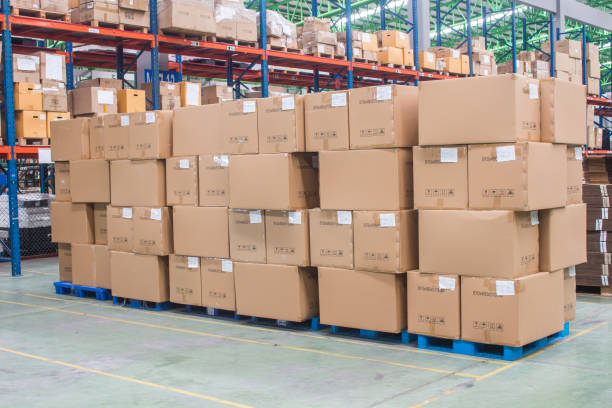 istock interior of warehouse. Rows of shelves with boxes 1269127112