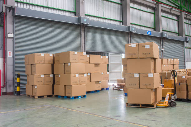 istock The forklift loading shipment carton boxes and goods on wooden pallet at loading dock from container truck to warehouse 1269127113