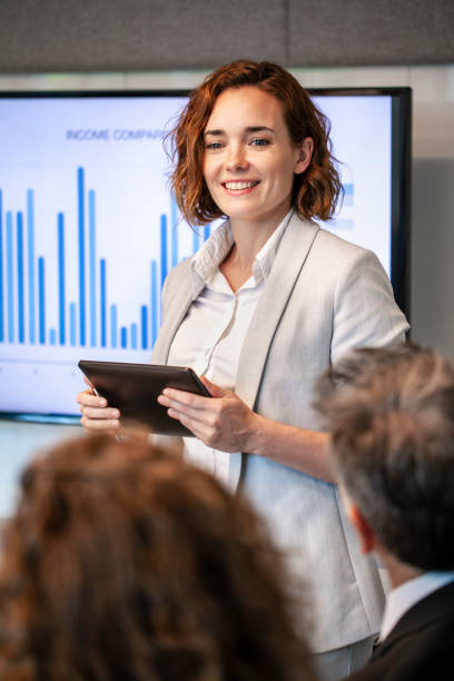 istock Young businesswoman giving presentation 1269128210