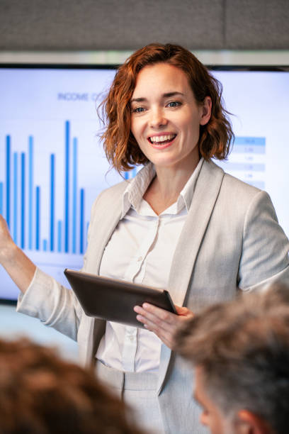 istock Young businesswoman giving presentation 1269128214
