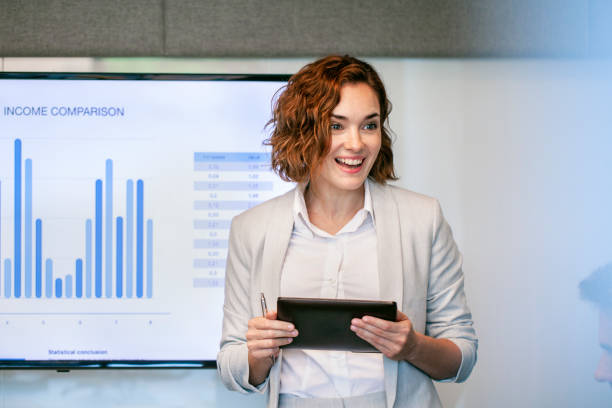 istock Young businesswoman giving presentation 1269128218