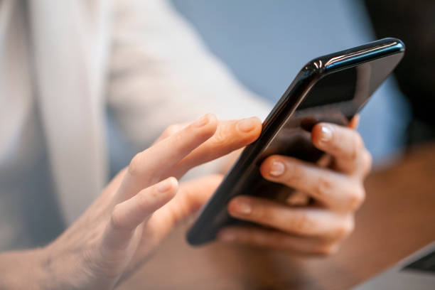istock Businesswoman using smart phone 1269128242