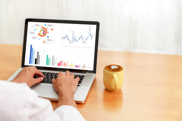 istock Businessman analyzing statistics on laptop screen, Hands man use laptop working with financial graphs charts online, Business and financial concept, With copy sapce 1269129673