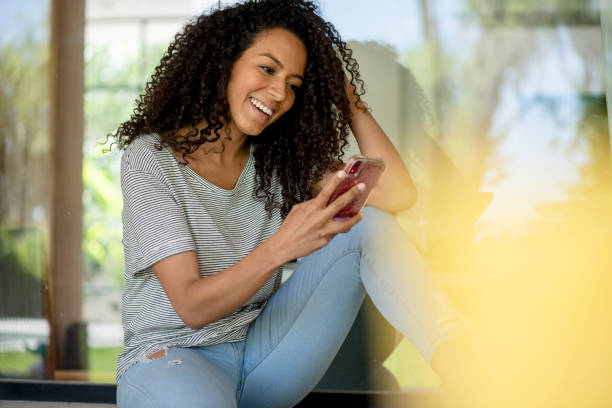 istock Young woman using smart phone 1269131178