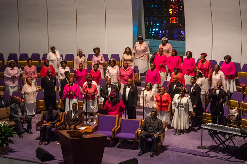 New York City, USA - October 8, 2017: Group of people singing gospel music in the Church The Greater Refuge Temple in Harlem, New York City