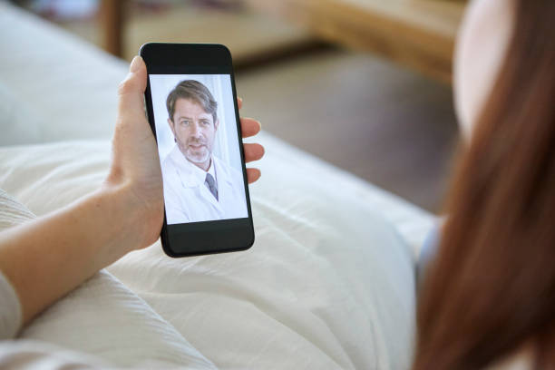 istock Woman having video call with doctor 1269131518
