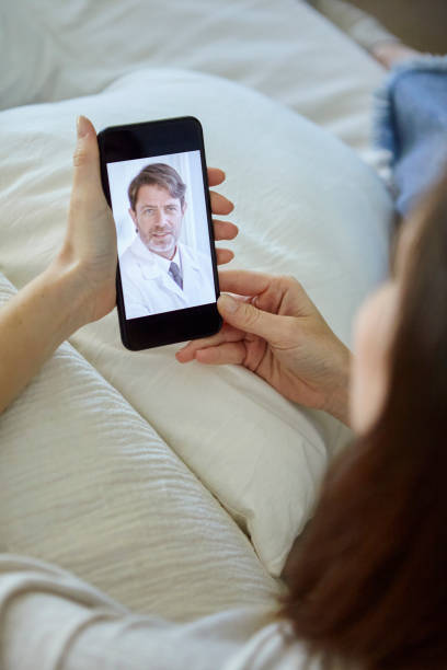 istock Woman having video call with doctor 1269131527