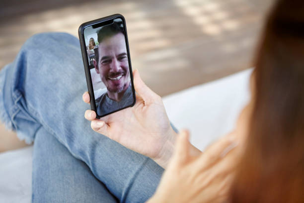 istock Woman having video call with her boyfriend 1269131533