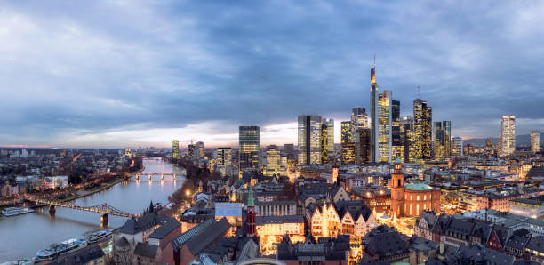 A high angle view over Frankfurt's city centre, with the River Main at the left, and the towers of the financial district  to the right.