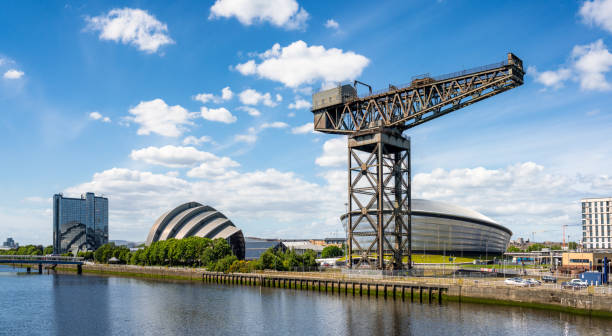 Glasgow Clydeside panorama A panoramic view along the north bank of the River Clyde in Glasgow, with hotels, the Hydro, the Armadillo and with the skyline dominated by the historic Finnieston Crane. clyde river stock pictures, royalty-free photos & images