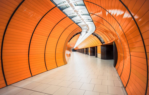 The distinctive retro bright orange tunnel design of the Marienplatz station on Munich's network.