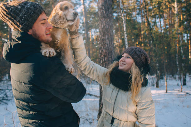 istock Young couple walking with dog 1269134055